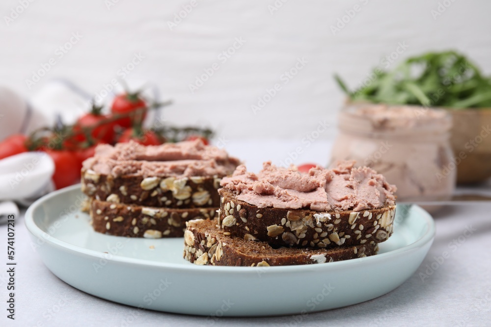 Delicious liverwurst sandwiches served on white table, closeup