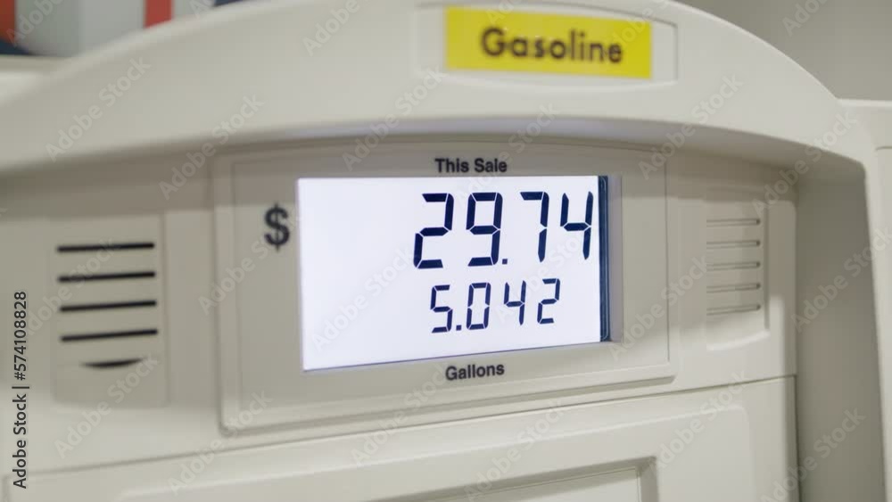 Close-up shot of a display with digital symbols changing during a refueling with petroleum at the station. Motion wallpaper for prices on fuel jumping and rising. High quality 4k footage Close-up shot of a display with digital symbols changing during a refueling with petroleum at the station. Motion wallpaper for prices on fuel jumping and rising. High quality 4k footage