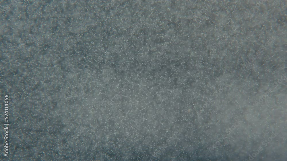 Abstract white particles float in water Abstract white particles float in water