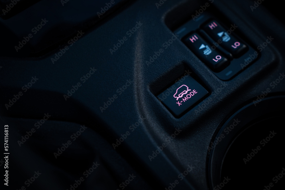 Activation button for all-wheel drive and vehicle locking systems x-mode