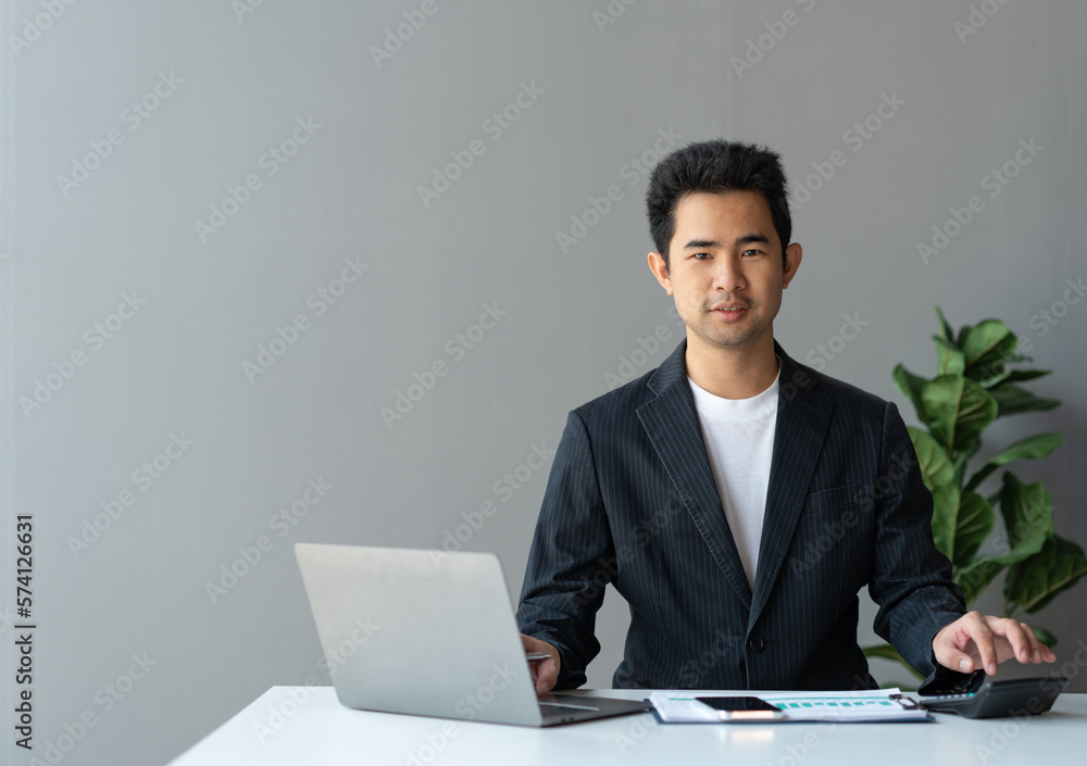 Asian businesswomen work using laptops and tablets, calculators to calculate make an account analysis report real estate investment information financial system concept and tax. Asian businesswomen work using laptops and tablets, calculators to calculate make an account analysis report real estate investment information financial system concept and tax.