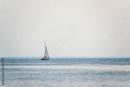 Sailing yacht in the blue calm sea.