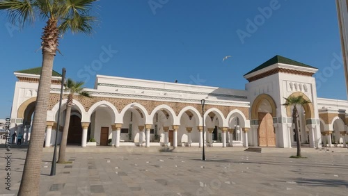 Masjid Lalla Abosh Mosque In Tangier in Morocco On Sunny Day With Blue Skies. Pan Right 