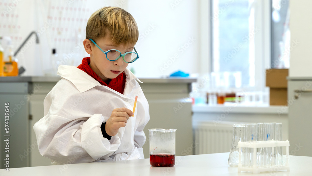 a student in a chemical laboratory conducts chemical sweats with chemical elements a student in a chemical laboratory conducts chemical sweats with chemical elements