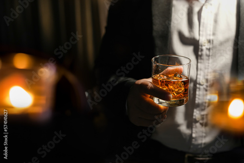 Closeup businessmen holding a glass of whiskey