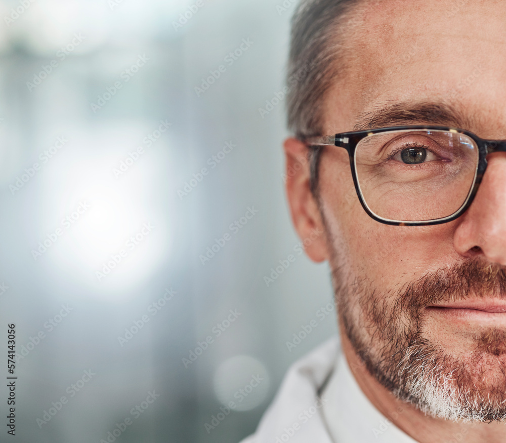 Doctor, face and portrait smile for healthcare, vision or career ambition in life insurance on mockup. Closeup of happy male medical expert half smiling for medicare against a blurred background Doctor, face and portrait smile for healthcare, vision or career ambition in life insurance on mockup. Closeup of happy male medical expert half smiling for medicare against a blurred background