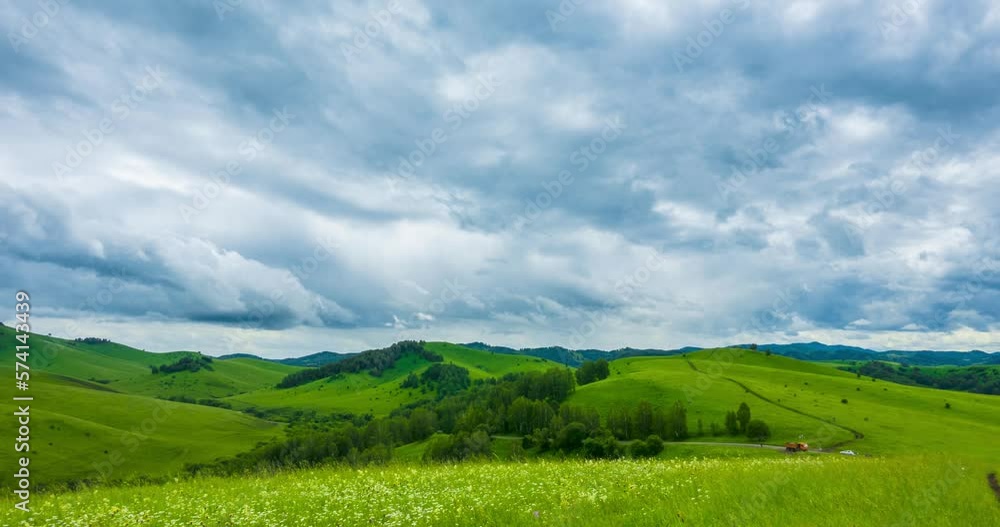 Mountain meadow time-lapse at the summer or autumn time. Wild nature and rural field. Fast clouds movement, green grass and sun rays. Motorised panorama Mountain meadow time-lapse at the summer or autumn time. Wild nature and rural field. Fast clouds movement, green grass and sun rays. Motorised panorama