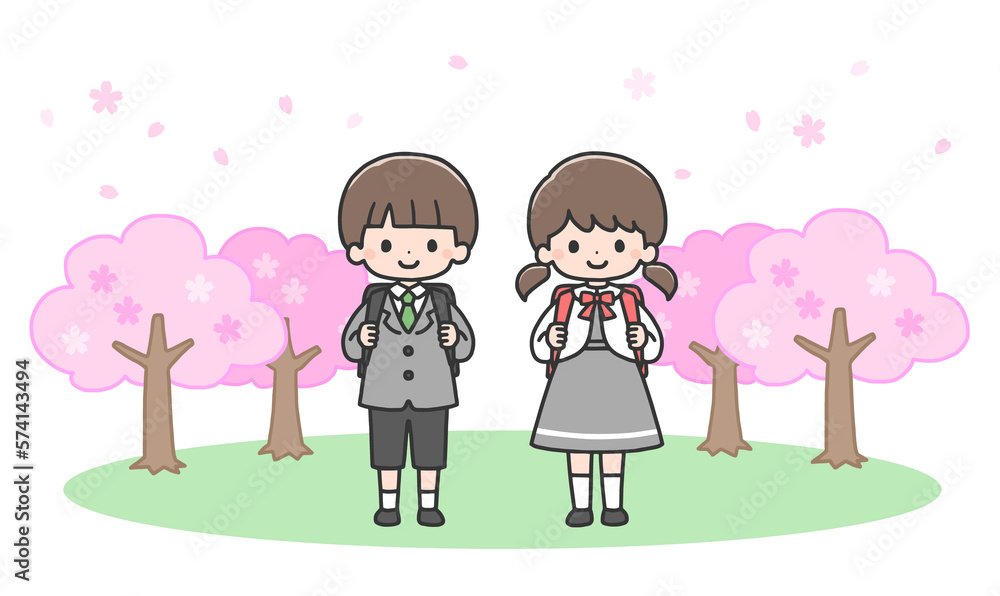 入学式　桜の前に立つ新一年生の男の子と女の子
