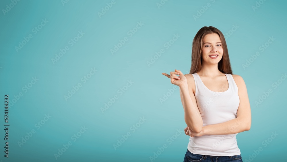 Friendly young girl pointing to the side
