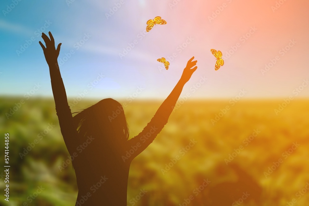 Smiling young woman and flying butterflies Smiling young woman and flying butterflies