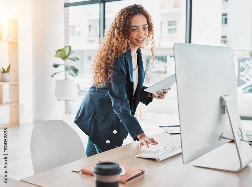 Obraz premium Businesswoman, computer and document in schedule tasks, planning or preparation strategy standing at office desk. Female employee manager checking desktop PC for project plan at the workplace