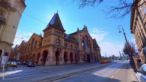 The yellow tram in front of Central Market Hall, Budapest, Hungary