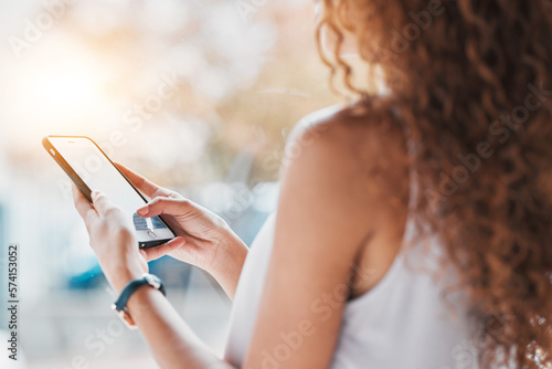 Hands, phone texting and black woman in city, summer sunshine and communication on web, app or chat. Smartphone, social network and girl with blurred background, reading and technology with email ux