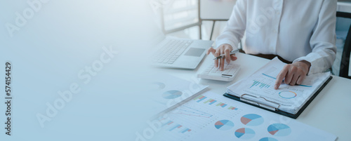 Close up accountant working on consolidated financial report of corporate operations, consultant auditing finance data (balance sheet, income statement) fintech.