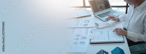 Obraz na płótnie Close up accountant working on consolidated financial report of corporate operations, consultant auditing finance data (balance sheet, income statement) fintech