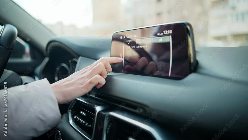driver sets up navigation system in car driver sets up navigation system in car