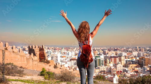 Happy tourist lookinat at panoramic view of Almeria city and Alcazaba- Spain