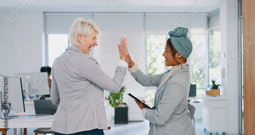 Senior  CEO and worker high five for support  team work or sales goals at a digital agency business office. Smile  women winning or happy employees with motivation  vision or mission for success