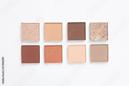 Beautiful eye shadow refill pans on white background, flat lay