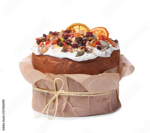 Traditional Easter cake with sprinkles and dried fruits in parchment paper isolated on white