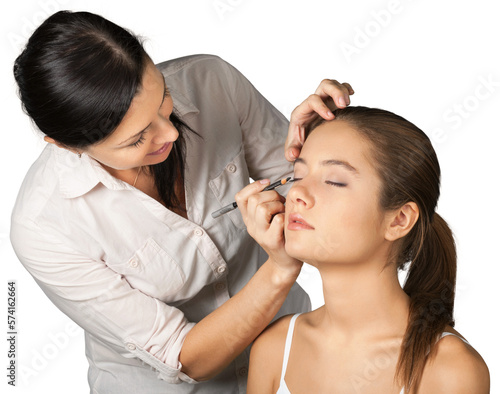 Professional makeup artist doing makeup for girl