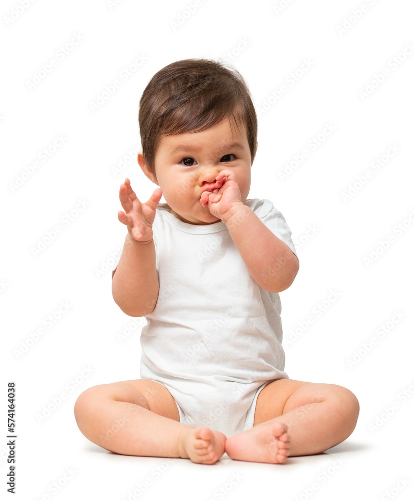 Cute baby rubbing mouth in white onesie on white background Cute baby rubbing mouth in white onesie on white background
