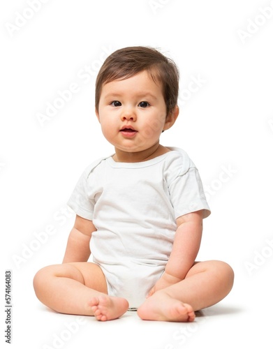Cute baby in white onesie on white background