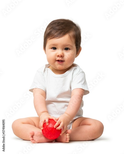 Cute baby with red ball in white onesie on white background