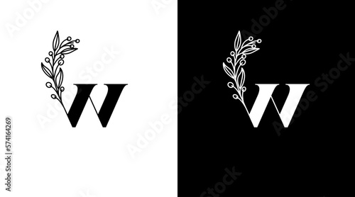 Letter w and elegant flower logo design initial vector monogram icon style template