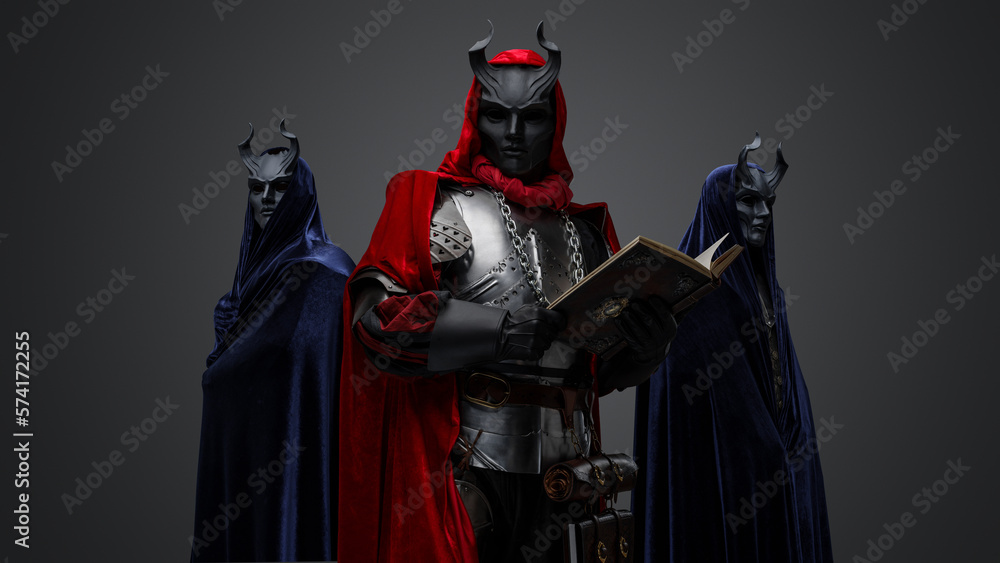 Portrait of two members of mysterious cult and their chief with book. Portrait of two members of mysterious cult and their chief with book.