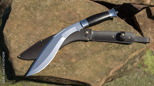 Cuadro en lienzo Kukri knife and leather scabbard lying on a stone. 3D rendering