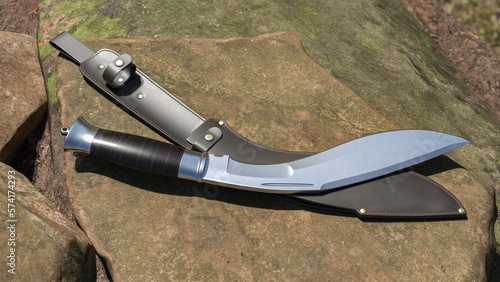 Fotografía Kukri knife and leather scabbard lying on a stone. 3D rendering