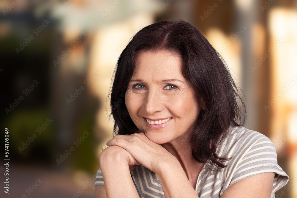 Beautiful senior old woman posing in park Beautiful senior old woman posing in park