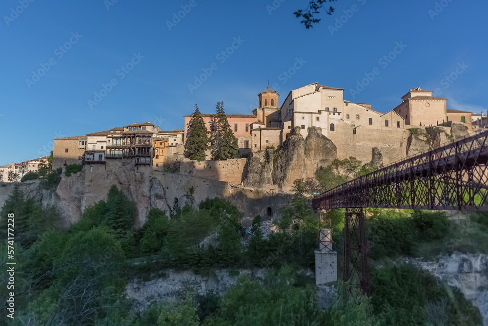 View at the Cuenca Hanging Houses, Casas Colgadas, typical architecture building on slope, metallic bridge, iconic architecture on Cuenca city