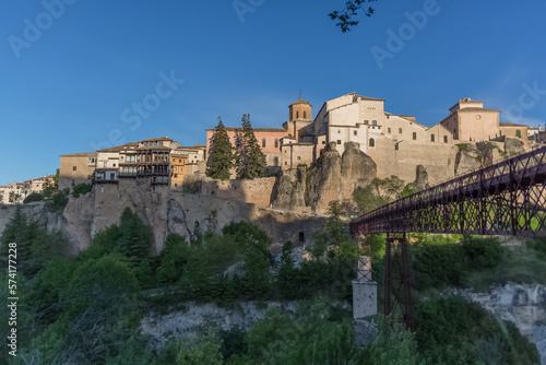 View at the Cuenca Hanging Houses, Casas Colgadas, typical architecture building on slope, metallic bridge, iconic architecture on Cuenca city