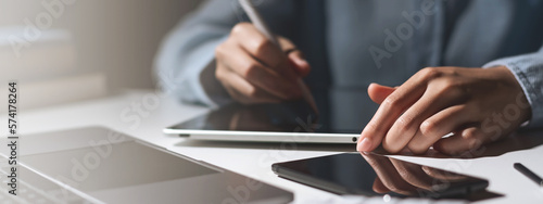 Hands of student using tablet and electronic pen. education e-learning concept for banner.