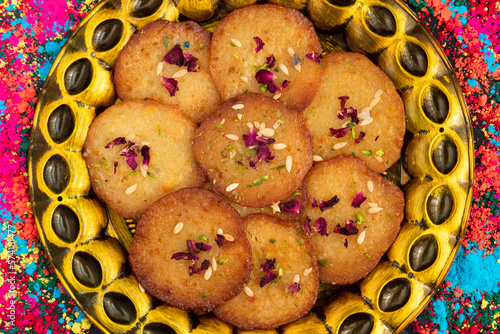 Juicy Sugary Pancakes Sweets Also Called Malpua, Pooa Or Pua Are Traditional Indian Dessert Mithai Drenched, Dunked, Soaked Or Dip In Sugar Syrup Cheeni Ki Chasni. Enjoyed On Holi, Navratri and Diwali