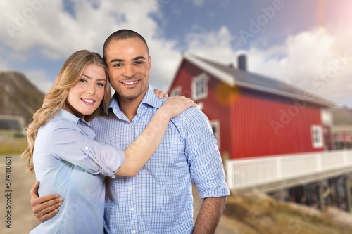 Happy young couple near house, lifestyle concept.