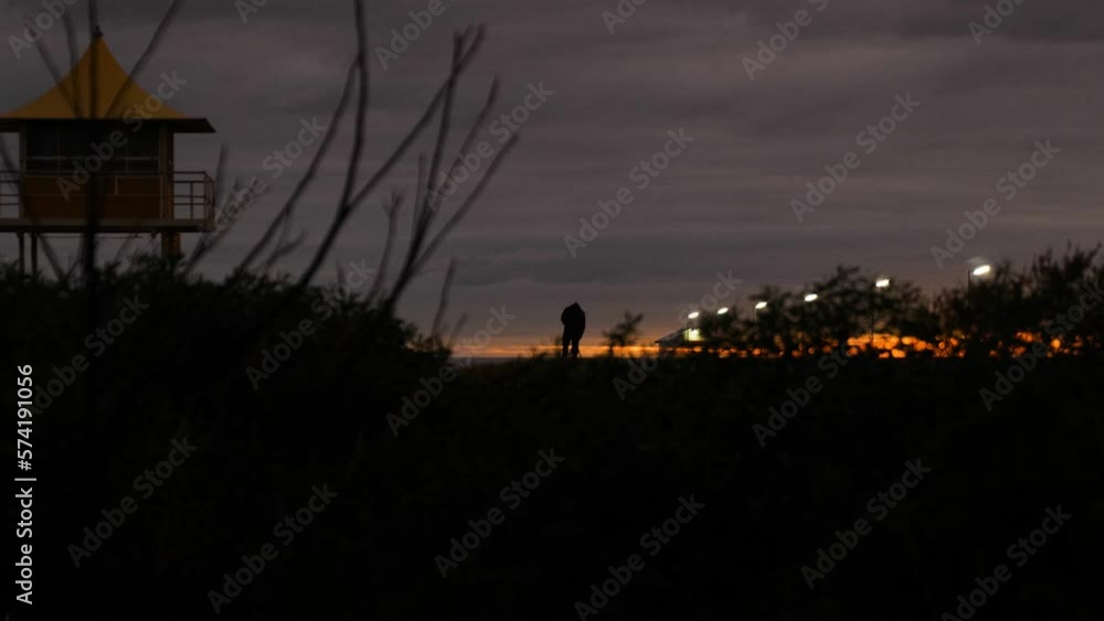 Person on Sand Dune Sunset on Beach Hut with Sunset Photographer on Beach Person on Sand Dune Sunset on Beach Hut with Sunset Photographer on Beach