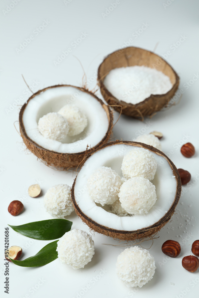 Concept of tasty sweets on white background, coconut candies Concept of tasty sweets on white background, coconut candies