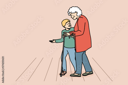Caring little boy child helping mature grandmother cross road. Cute small kid hold hand assist elderly woman walk on street. Vector illustration. 