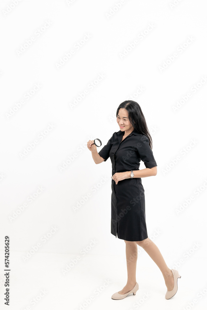 Accountant gestures for a magnifying glass to shine Business accounting audit concept isolated through white background