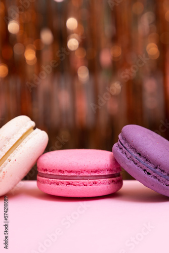 Sweet colorful macarons  on pink background. Tasty colourful macaroons. High quality photo