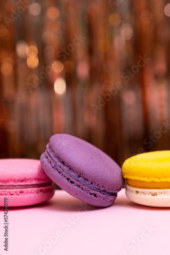 Sweet colorful macarons  on pink background. Tasty colourful macaroons. High quality photo