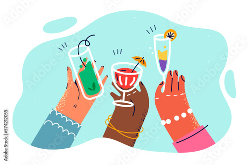 Hands with different skin colors with glasses filled with cocktails and drinks for Friday party