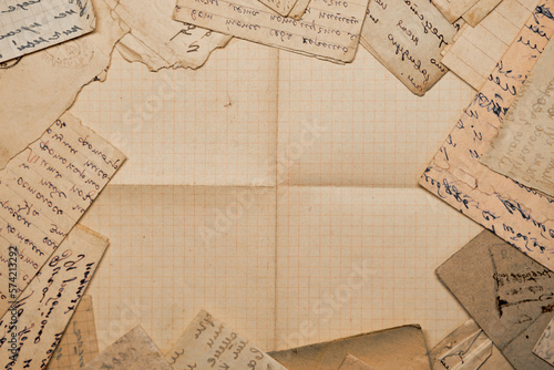 Old handwritten postal letters and a blank old sheet of paper