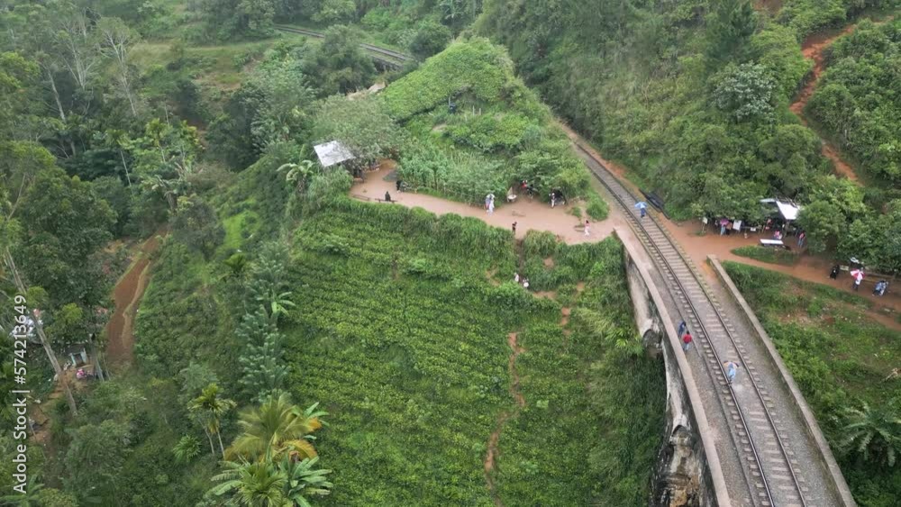 Cinematic aerial shot over Nine Arch Bridge Ella in Sri Lanka. Exotic natural vegetation surrounding a bridge. Cinematic aerial shot over Nine Arch Bridge Ella in Sri Lanka. Exotic natural vegetation surrounding a bridge.