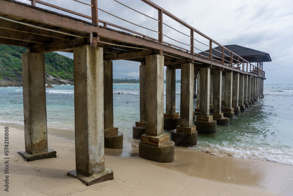  tropical beach in Banda Aceh, Indonesia. Eky Momong Beach. Resataurant at the beach. Concrete bridge leading to water villa or bungalow.