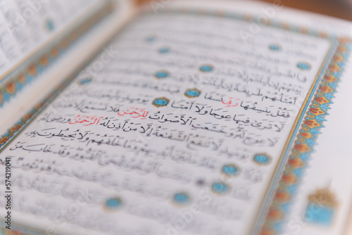 Sarajevo, Bosnia and Herzegovina, 20th february 2023; Muslim beads and Koran or Qoran on wooden table. Islamic religion concept.