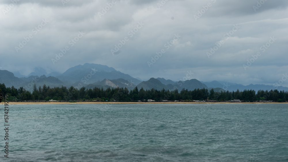 Blue sea and tropical island. holiday and vacation concept. Beautiful view of beach landscape at eky momong beach in Banda Aceh, Indonesia. Blue sea and tropical island. holiday and vacation concept. Beautiful view of beach landscape at eky momong beach in Banda Aceh, Indonesia.